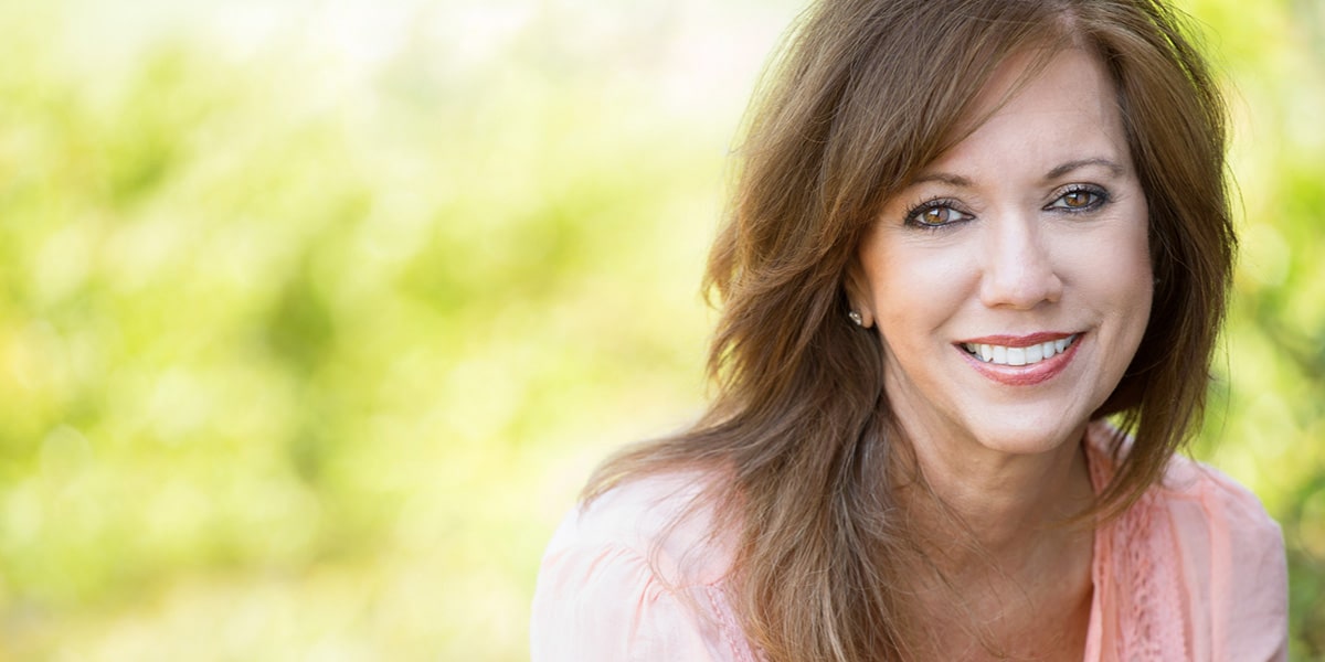 Smiling Woman Pink Shirt